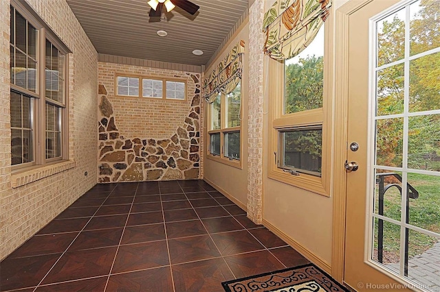 interior space featuring plenty of natural light and ceiling fan