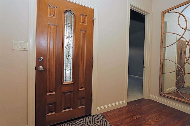 foyer entrance featuring dark hardwood / wood-style floors