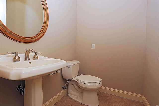 bathroom featuring toilet and tile patterned floors