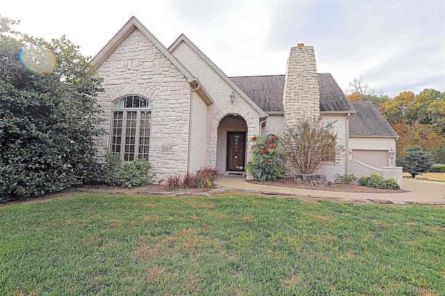 french country inspired facade with a front yard