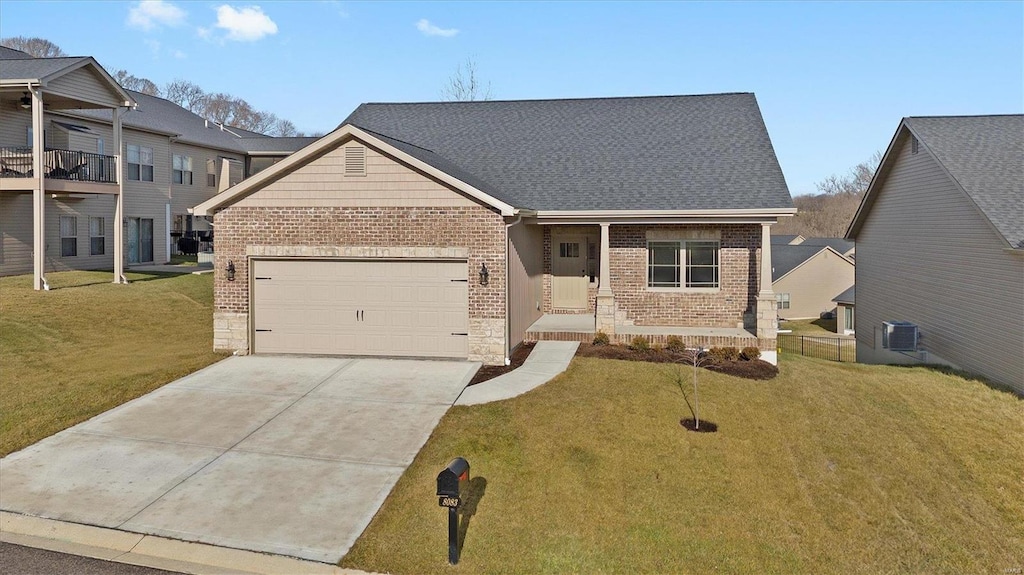 view of front of property featuring a garage and a front yard