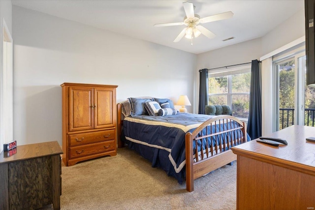 bedroom featuring access to outside, ceiling fan, and light colored carpet