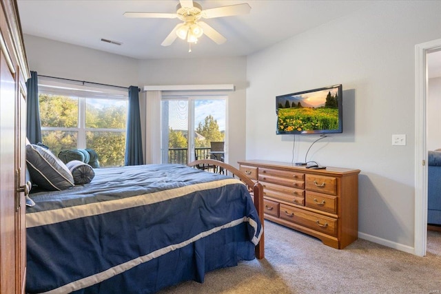 bedroom with ceiling fan, access to outside, and carpet