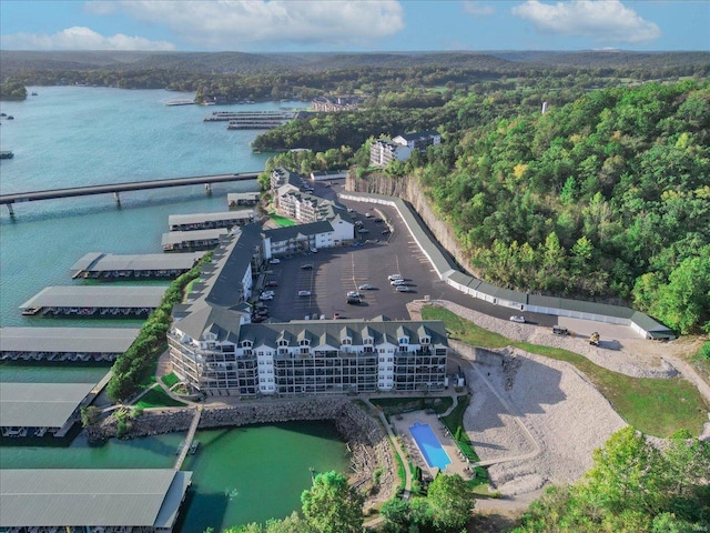 birds eye view of property with a water view