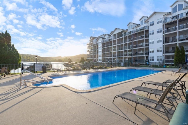 view of swimming pool with a patio