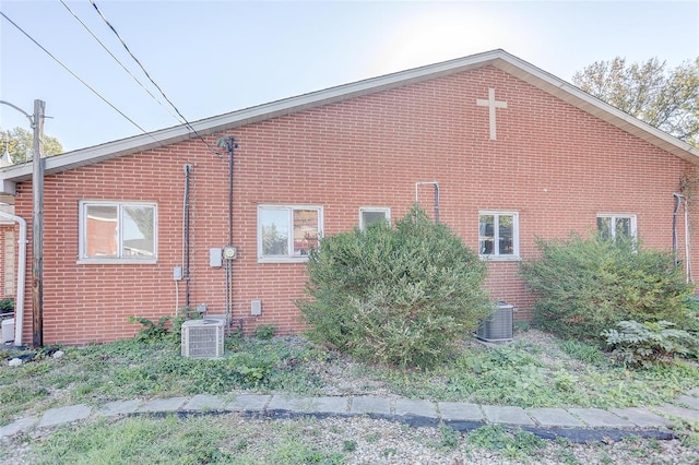 view of property exterior with central AC