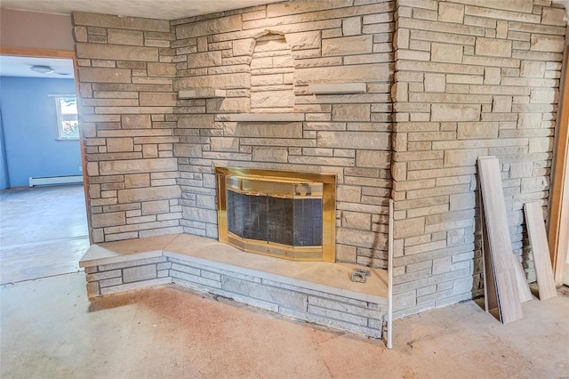 room details with a fireplace, concrete floors, and a baseboard radiator