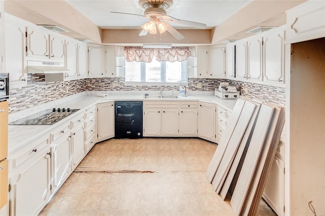 kitchen featuring sink, white cabinets, custom exhaust hood, black appliances, and ceiling fan