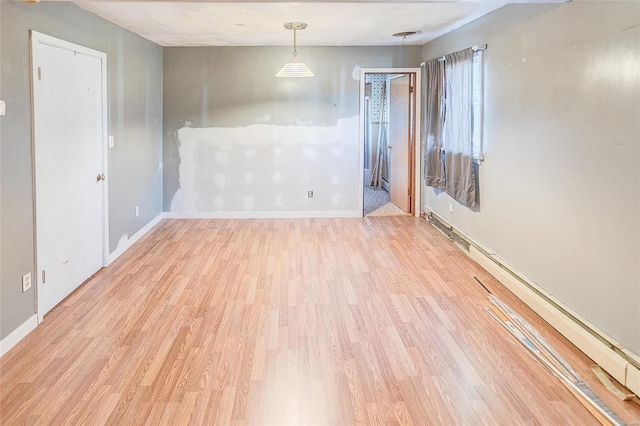 spare room featuring light wood-type flooring