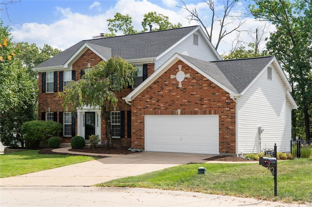 view of front of home featuring a garage and a front yard