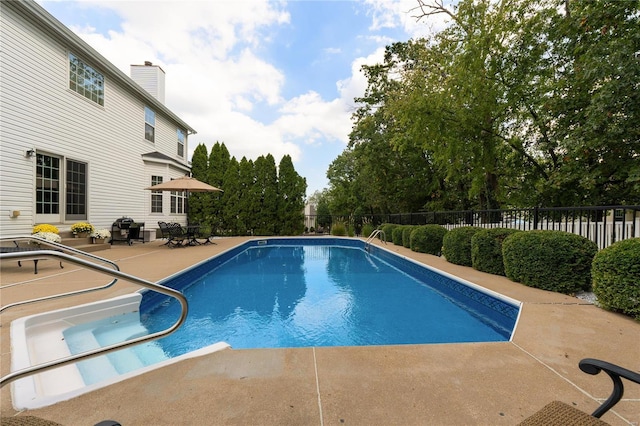 view of pool featuring a patio