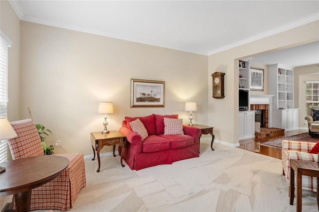 carpeted living room with crown molding and a fireplace