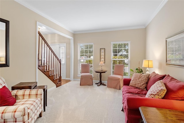 living room featuring ornamental molding and carpet floors