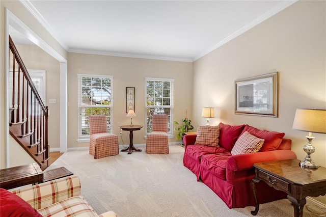 living room featuring ornamental molding, plenty of natural light, and light colored carpet