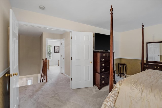 bedroom featuring light carpet