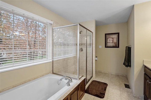 bathroom with vanity, tile patterned flooring, and separate shower and tub