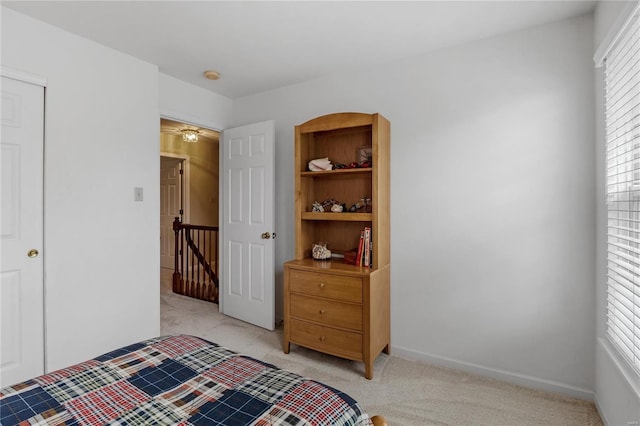 bedroom with light colored carpet