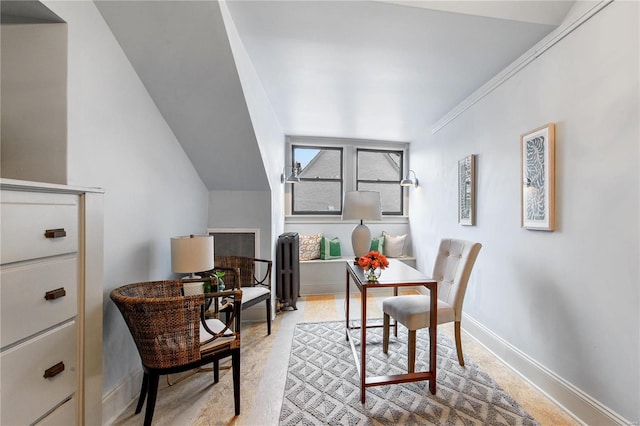 carpeted office space with radiator heating unit, lofted ceiling, and ornamental molding