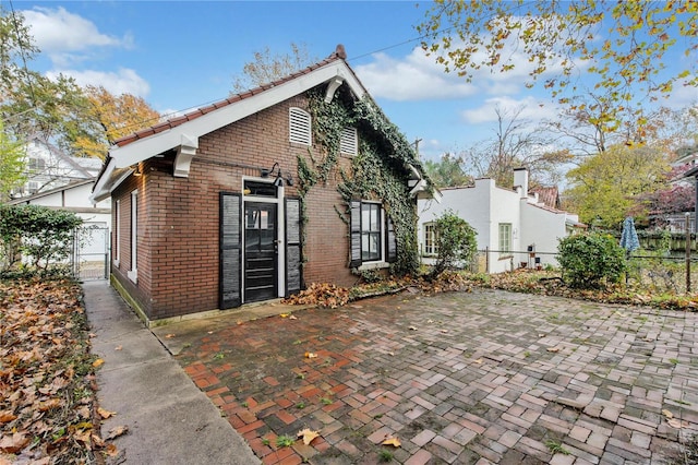 rear view of house with a patio