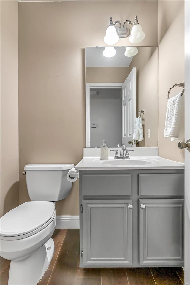 bathroom featuring vanity and toilet