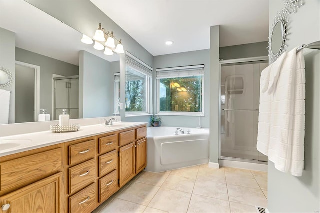 bathroom with independent shower and bath, vanity, and tile patterned flooring