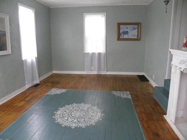 living room with ornamental molding and dark hardwood / wood-style flooring