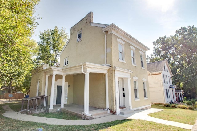 view of front of property with a front lawn and a porch