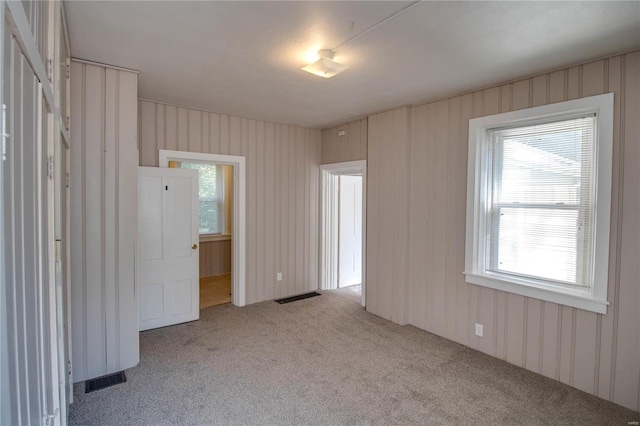 empty room featuring light colored carpet