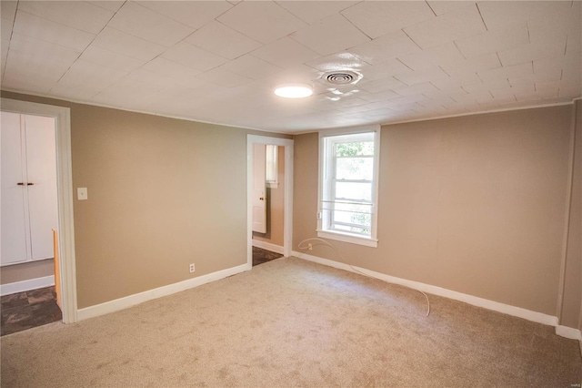 spare room featuring carpet flooring