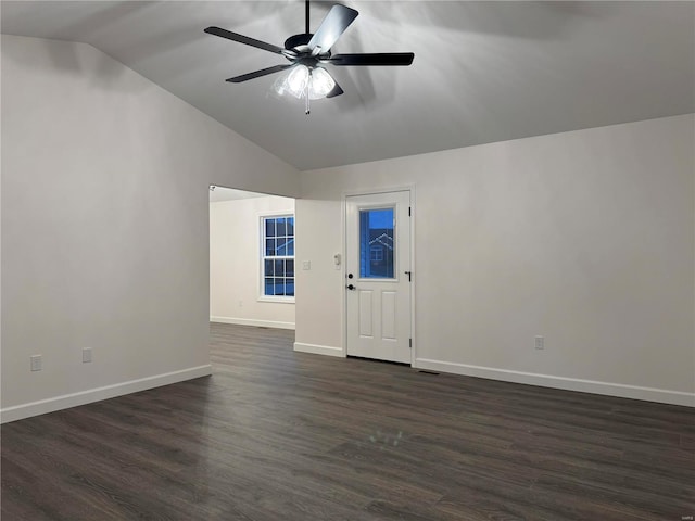 spare room featuring ceiling fan, lofted ceiling, and dark wood-type flooring