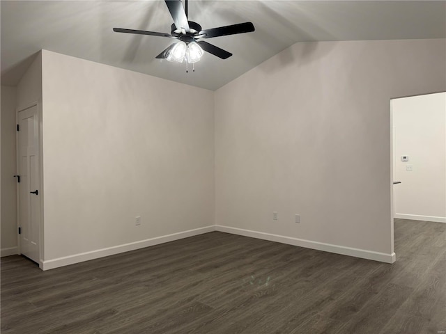 unfurnished room with ceiling fan, dark wood-type flooring, and lofted ceiling