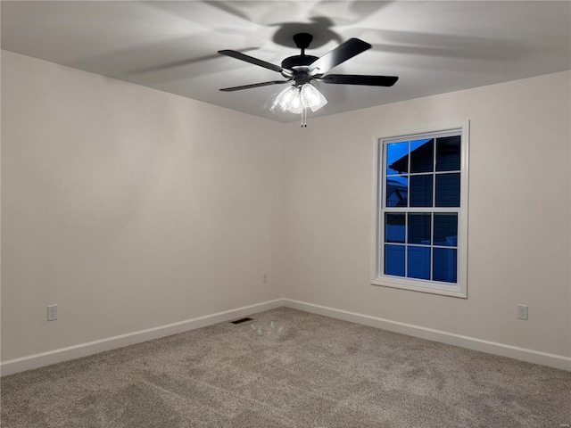 carpeted empty room with ceiling fan