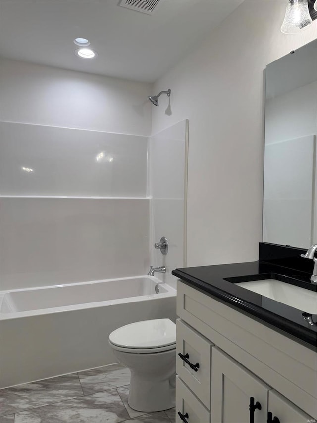 full bathroom with vanity, bathtub / shower combination, and toilet