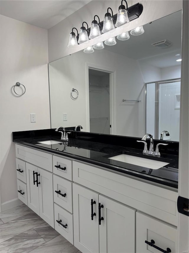 bathroom featuring vanity and walk in shower