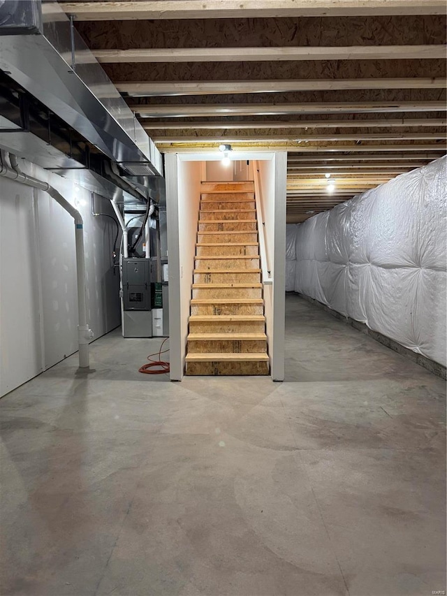 basement featuring heating unit