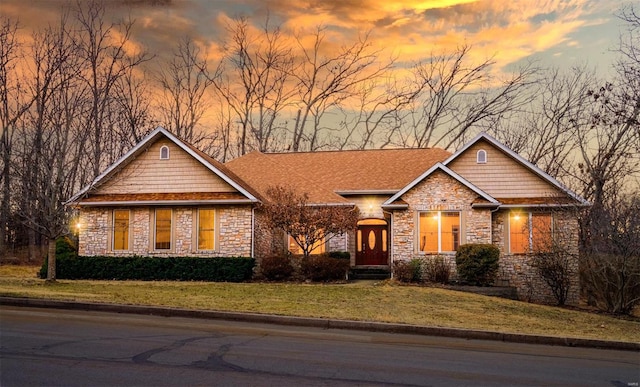 craftsman inspired home with a lawn