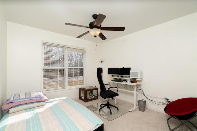 bedroom with ceiling fan and light carpet