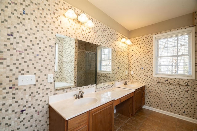 bathroom featuring tile walls, tile patterned flooring, vanity, and a shower with door