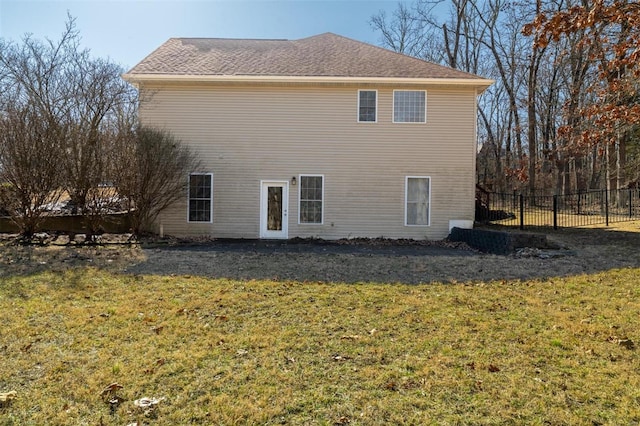 view of side of home featuring a yard