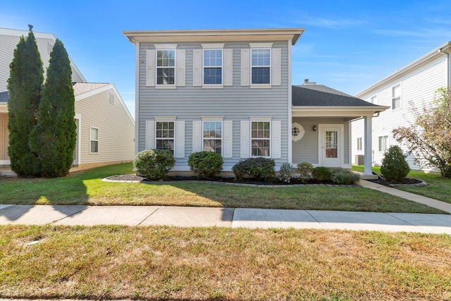 view of front of property with a front lawn