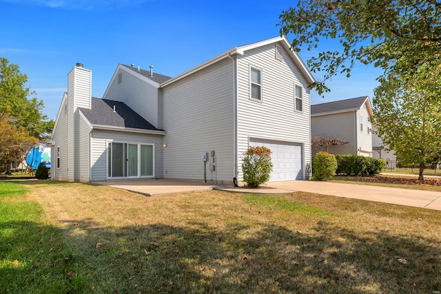 exterior space featuring a yard and a garage