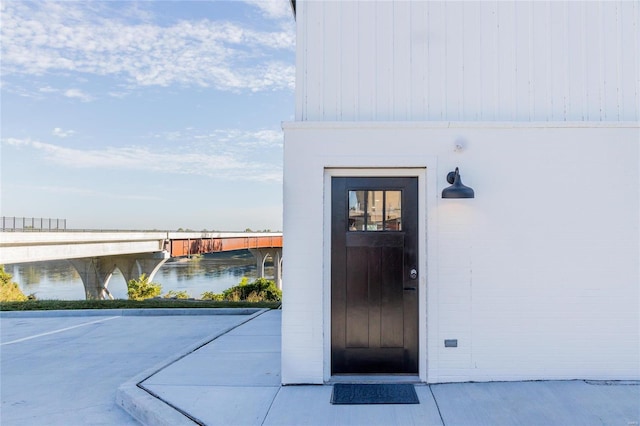 entrance to property featuring a water view