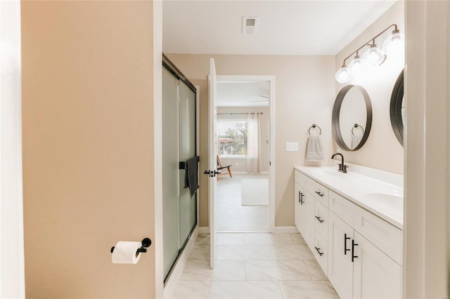 bathroom with vanity and walk in shower