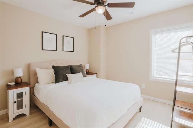 bedroom featuring light hardwood / wood-style flooring and ceiling fan