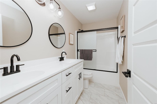 full bathroom with toilet, vanity, and shower / bath combination with glass door