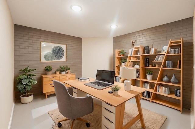 office area with brick wall