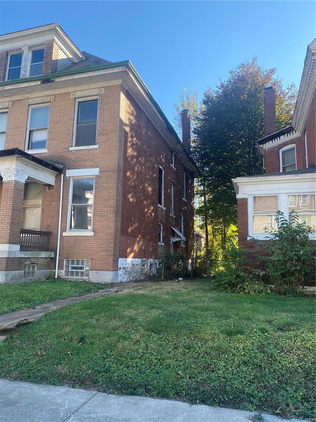 view of home's exterior featuring a lawn