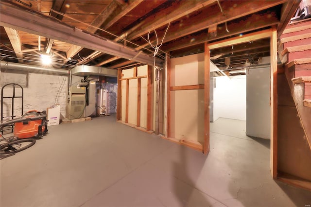 basement with water heater and heating unit