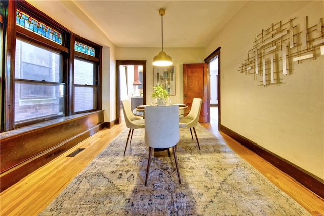 dining room with light hardwood / wood-style flooring