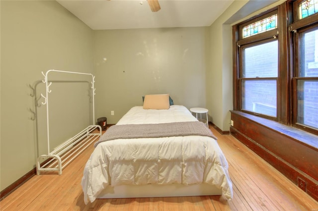 bedroom featuring light hardwood / wood-style floors and ceiling fan